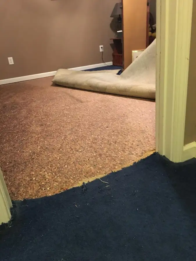 Carpet pad removal revealing water damage during Drying & Dehumidification in Aloha